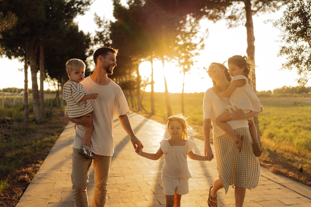 Crafting Captivating Headlines: Your awesome post title goes here A joyful family walking together on a sunlit path during sunset, enjoying an outdoor stroll.
